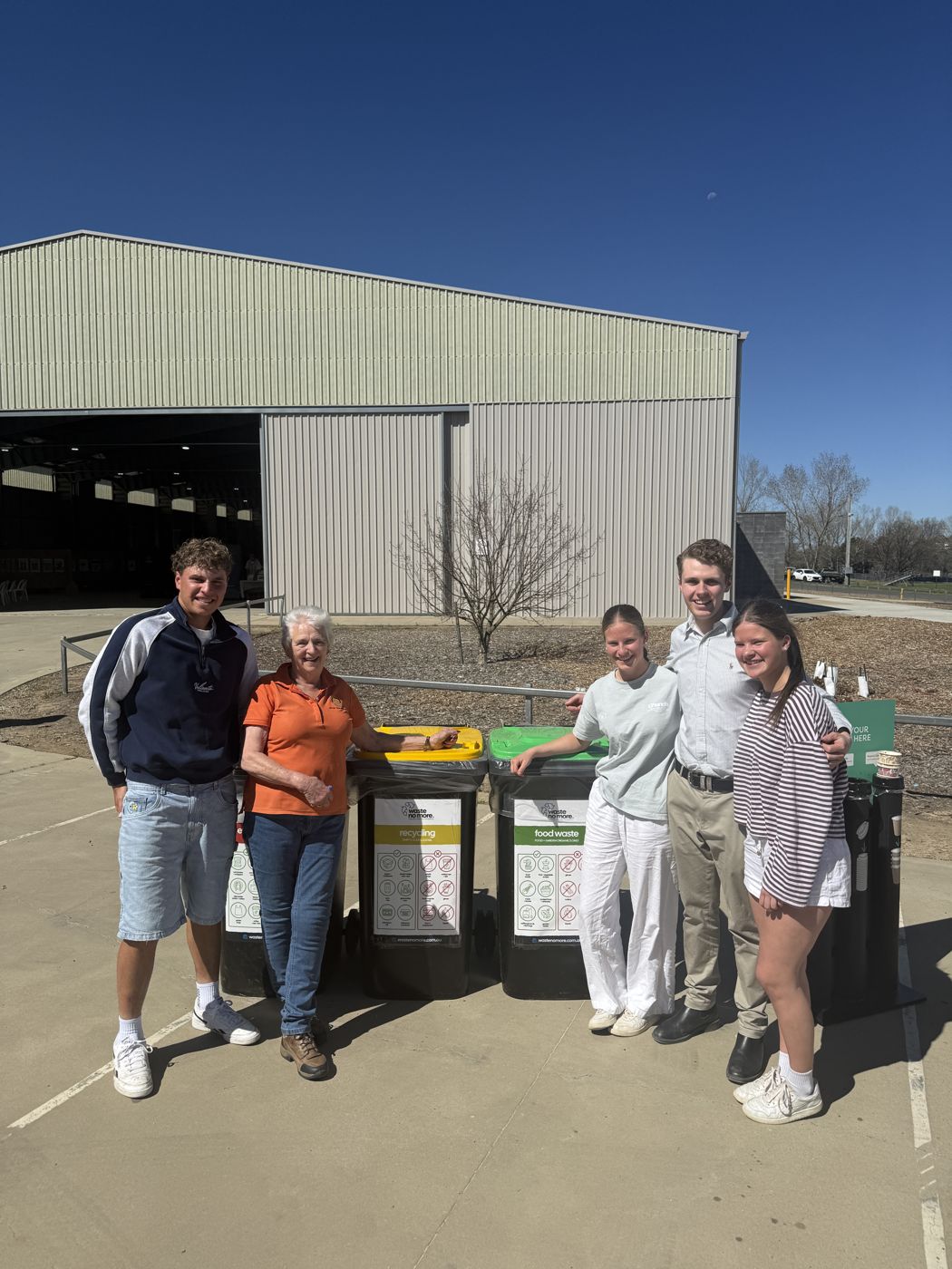 The Waste No More team with a Rotary Club of Orange member at a bin station at the Orange Sustainable Living Expo 2026